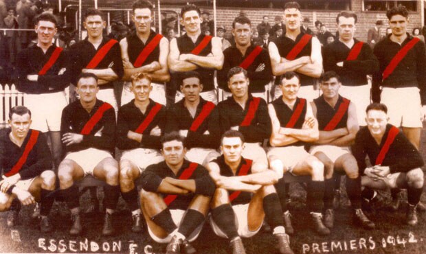 20170928_1942Colour_H.jpg Dick Reynolds (seated, third from left) led Essendon to the premiership in 1942 - the Club's first flag in almost 20 years. - Essendon,Essendon Bombers